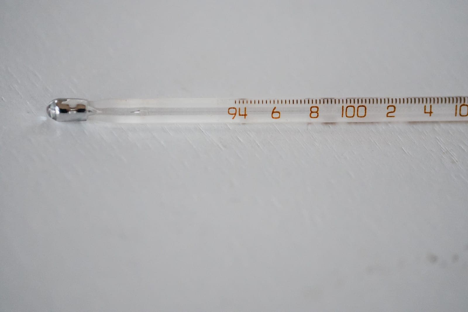 A thermometer reading the temperature of a hot liquid